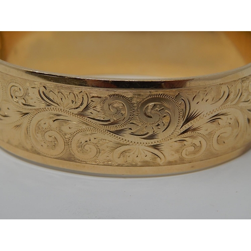 39 - 9ct Gold Metal Core Bangle with Safety Chain.