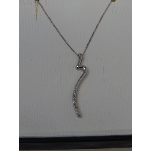 56 - 9ct white gold diamond pendant on 9ct white gold chain. Length 38cm