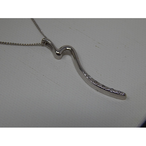 56 - 9ct white gold diamond pendant on 9ct white gold chain. Length 38cm