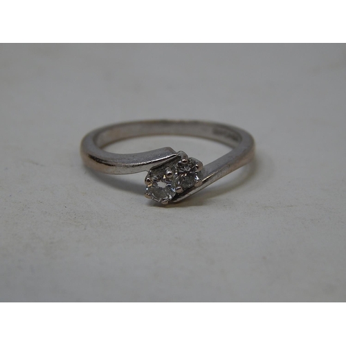 58 - 18ct white gold diamond two stone ring 0.25ct, size L.