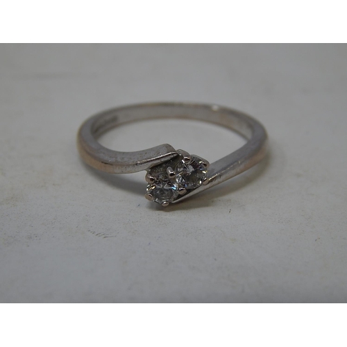 58 - 18ct white gold diamond two stone ring 0.25ct, size L.