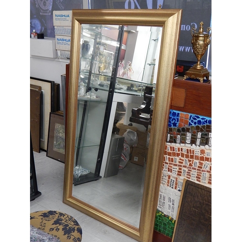 828 - Modern Giltwood Framed Mirror. Measures 137cm x 76cm