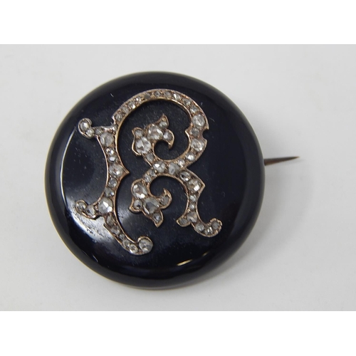 66 - A Gold Backed Jet Mourning Brooch/Locket with Rose Cut Diamond Initial 