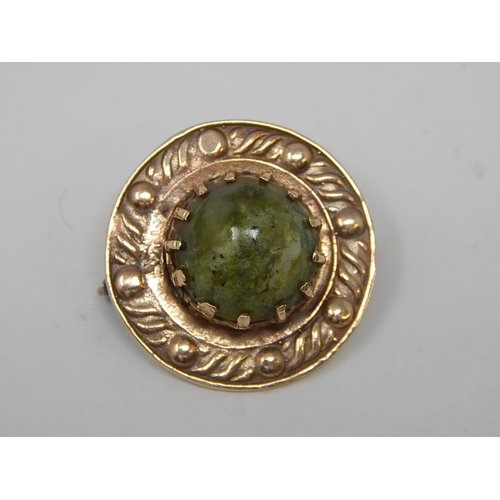 76 - 9ct Gold Arts & Crafts Style Brooch with Spinach Jade Cabochon. Diameter 2.5cm