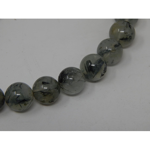 77 - Designer Ruticulated Green Prehrite Bead Necklace with Silver Fittings together with a similar ring