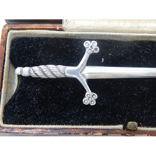 12 - Silver Kilt Pin Formed as a Scottish Sword. Bears strike marks & Initials:  Length 9cm