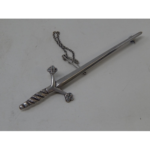 12 - Silver Kilt Pin Formed as a Scottish Sword. Bears strike marks & Initials:  Length 9cm