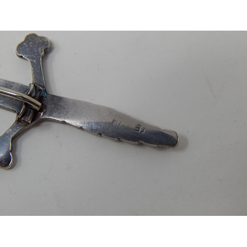 12 - Silver Kilt Pin Formed as a Scottish Sword. Bears strike marks & Initials:  Length 9cm