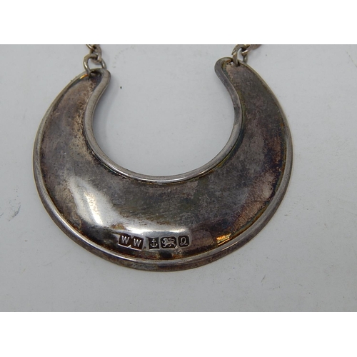 27 - Silver Hallmarked Crescent Shaped Decanter Label.