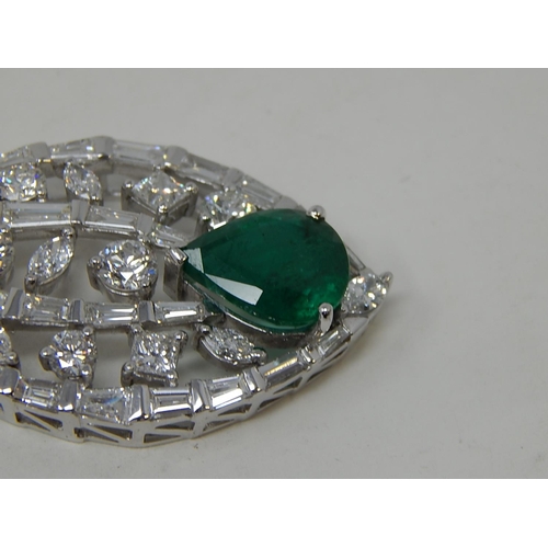 100 - Emerald and diamond pendant, marquise shaped openwork pendant set with a pear cut emerald at the bot... 