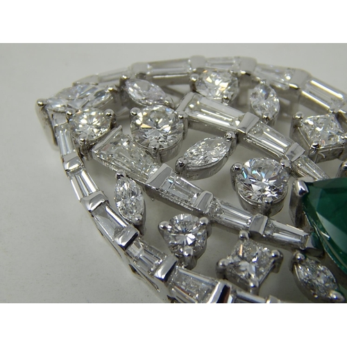 100 - Emerald and diamond pendant, marquise shaped openwork pendant set with a pear cut emerald at the bot... 