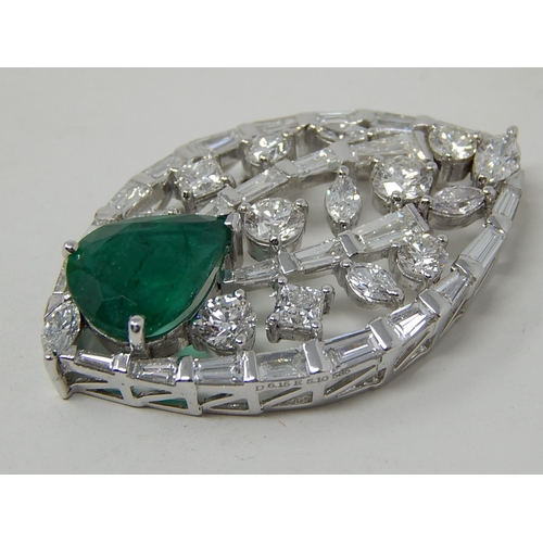 100 - Emerald and diamond pendant, marquise shaped openwork pendant set with a pear cut emerald at the bot... 