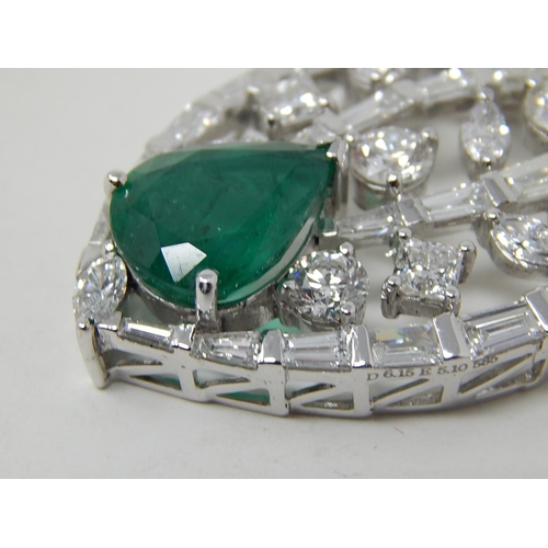 100 - Emerald and diamond pendant, marquise shaped openwork pendant set with a pear cut emerald at the bot... 