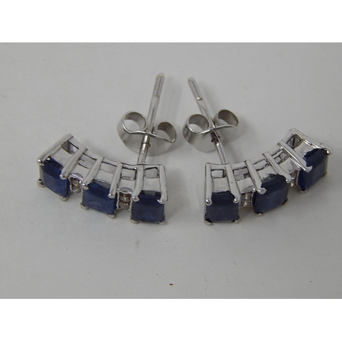 104 - Sapphire and diamond earrings, three rectangular cut sapphires vertically set with two round brillia... 