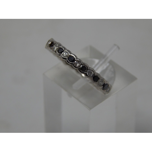 105 - Black and white diamond full eternity ring, alternating round cut black and white diamonds set in wh... 