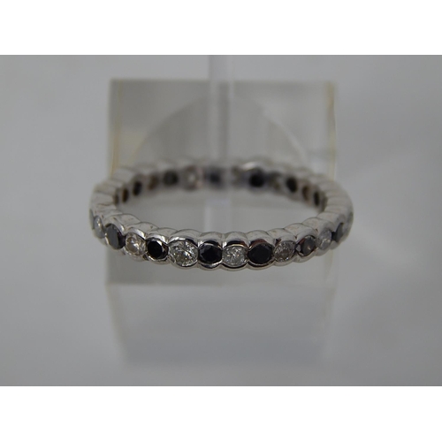 105 - Black and white diamond full eternity ring, alternating round cut black and white diamonds set in wh... 