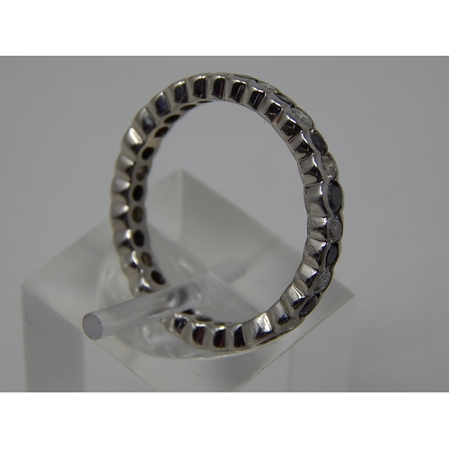 105 - Black and white diamond full eternity ring, alternating round cut black and white diamonds set in wh... 