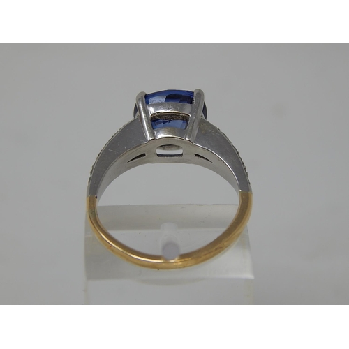 112 - Sapphire and diamond dress ring, central cushion cut sapphire weighing an estimated 3.00cts, four cl... 