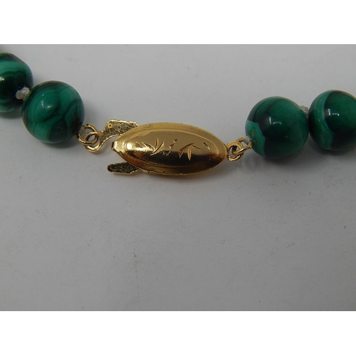 113 - Malachite Necklace with silver gilt clasp