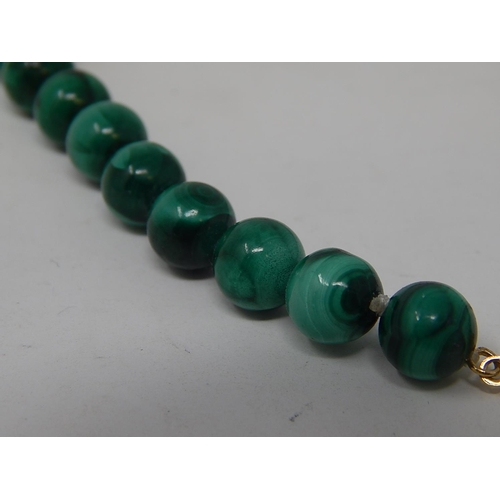 113 - Malachite Necklace with silver gilt clasp