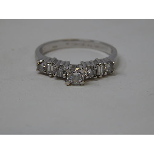 115 - 18ct White Gold Ring Inset with a central diamond flanked either side by three further diamonds. Rin... 