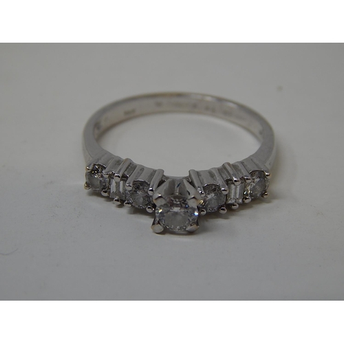 115 - 18ct White Gold Ring Inset with a central diamond flanked either side by three further diamonds. Rin... 