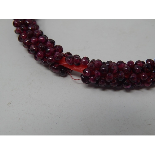 117 - Garnet Bead Necklace, length 70cm together with a Garnet Bead Bangle a/f.