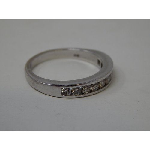 133 - 18ct White Gold Ring Inset with 10 Diamonds, Chanel Set. Ring Size O1/2