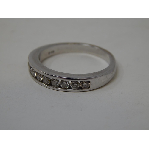 133 - 18ct White Gold Ring Inset with 10 Diamonds, Chanel Set. Ring Size O1/2