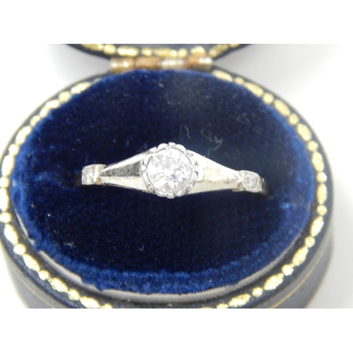 134 - Art Deco Diamond ring, central set round cut diamond, weighing an estimated 0.25ct, flanked either s... 