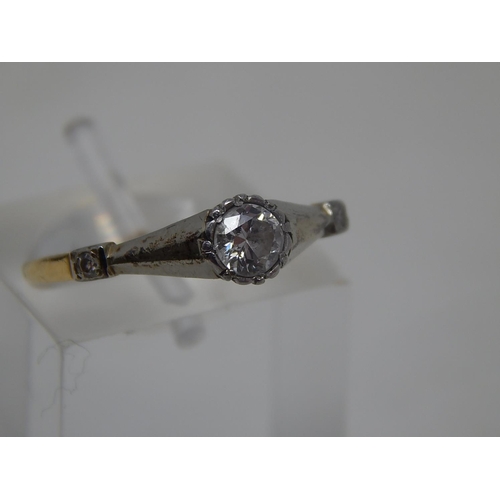 134 - Art Deco Diamond ring, central set round cut diamond, weighing an estimated 0.25ct, flanked either s... 