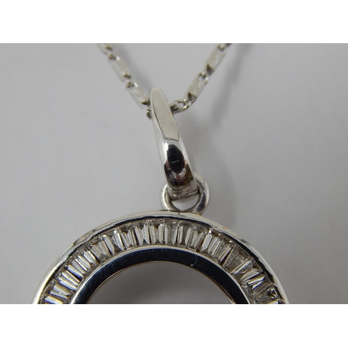 139 - 18ct White Gold Pendant inset with a circle of Baguette Cut Diamonds on an 18ct White Gold Chain. Bo... 