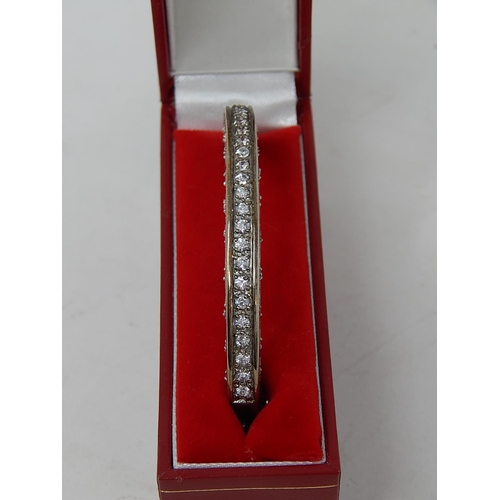 144 - Silver Hinged Bangle set with white stones: Internal diameter 5.5cm: Presented in Fitted Case.