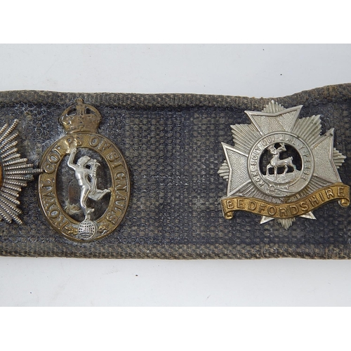 302 - WW1: Military Belt adorned with 12 Military Badges