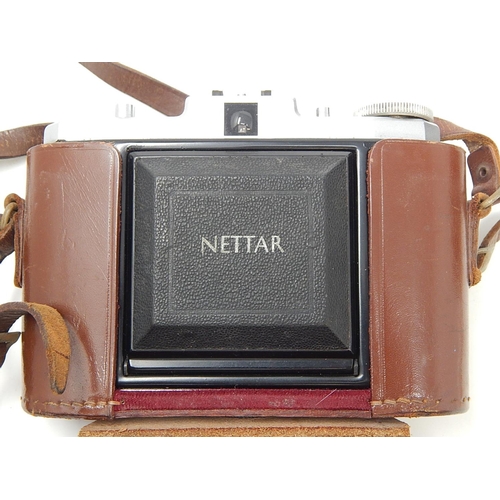 306 - Zeiss Ikon Nettar Camera together with two Kodak Cameras, all in fitted cases.