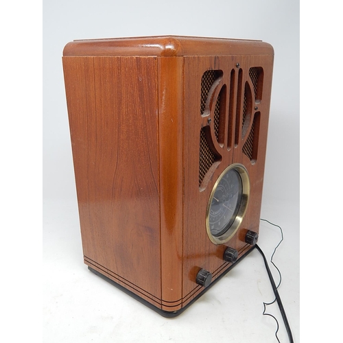 322 - Wooden Cased Electric Radio. 33cm high