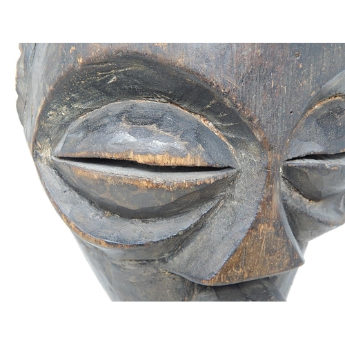 350 - Tribal Mask carved from one piece of wood on later Metal Stand: Measures 31cm high