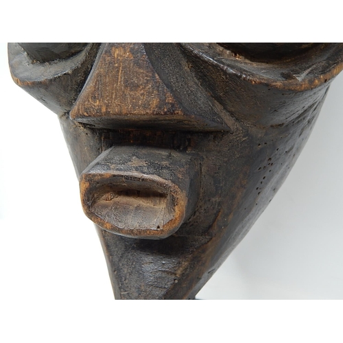 350 - Tribal Mask carved from one piece of wood on later Metal Stand: Measures 31cm high