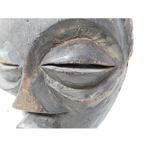 350 - Tribal Mask carved from one piece of wood on later Metal Stand: Measures 31cm high