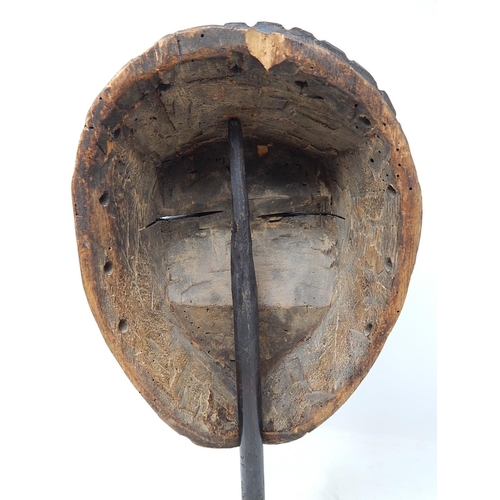 350 - Tribal Mask carved from one piece of wood on later Metal Stand: Measures 31cm high