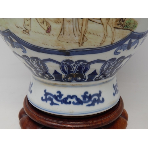 385 - Chinese blue and white porcelain vase, with twin handles raised on hardwood stand, the two central p... 