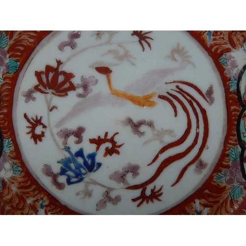 386 - Three Chinese porcelain plates including a pair hand painted with panels of dragons, the largest 22.... 