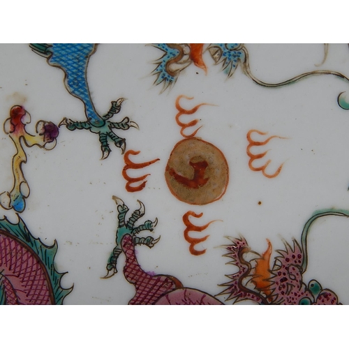 387 - WITHDRAWN: Chinese porcelain shallow dish, hand painted in the famille rose palette with objects and... 