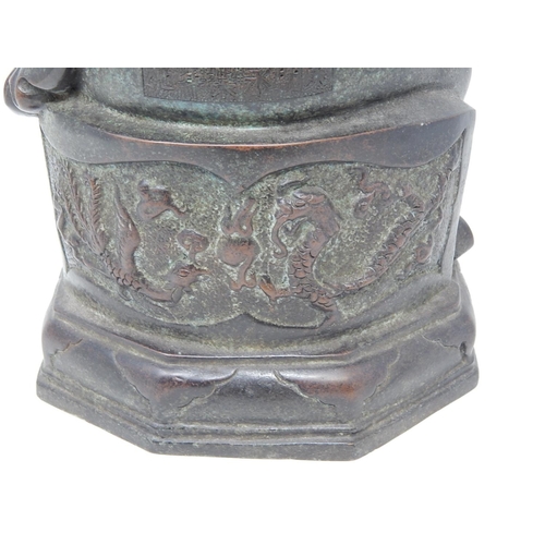 390 - Chinese bronze study of a seated emperor, character marks to the reverse, 38.5cm high