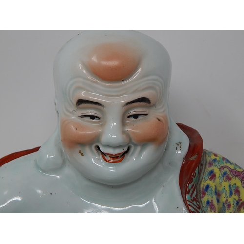 391 - Chinese porcelain figure of Buddha holding a sack, finely hand painted in the famille rose palette, ... 