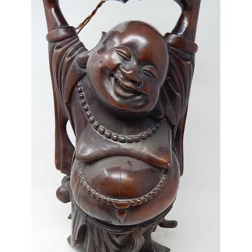 392 - Large Chinese hardwood carved laughing Buddah table lamp. Height 56cm