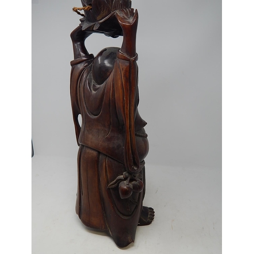 392 - Large Chinese hardwood carved laughing Buddah table lamp. Height 56cm