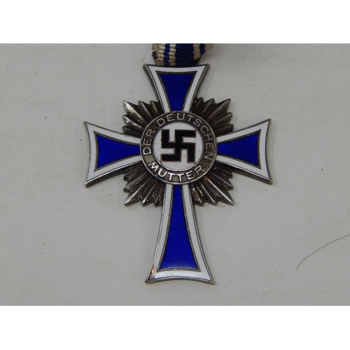 408 - German 1st Class Silver Mothers Cross on Ribbon. Inscribed to reverse.