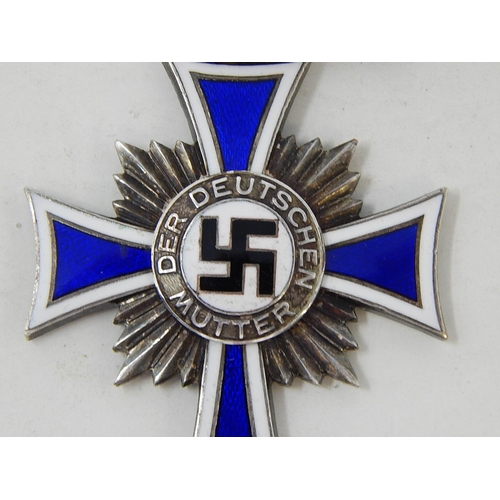 408 - German 1st Class Silver Mothers Cross on Ribbon. Inscribed to reverse.