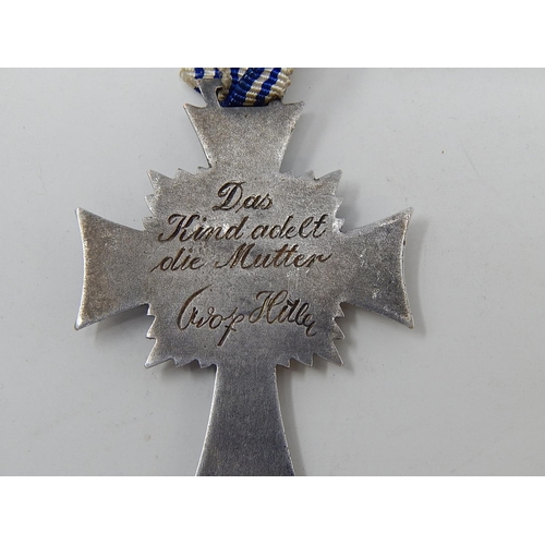 408 - German 1st Class Silver Mothers Cross on Ribbon. Inscribed to reverse.